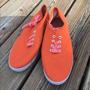 Orange and white stripped tennis shoes