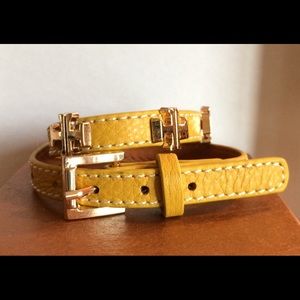 Wrap bracelet with metal cross charms.