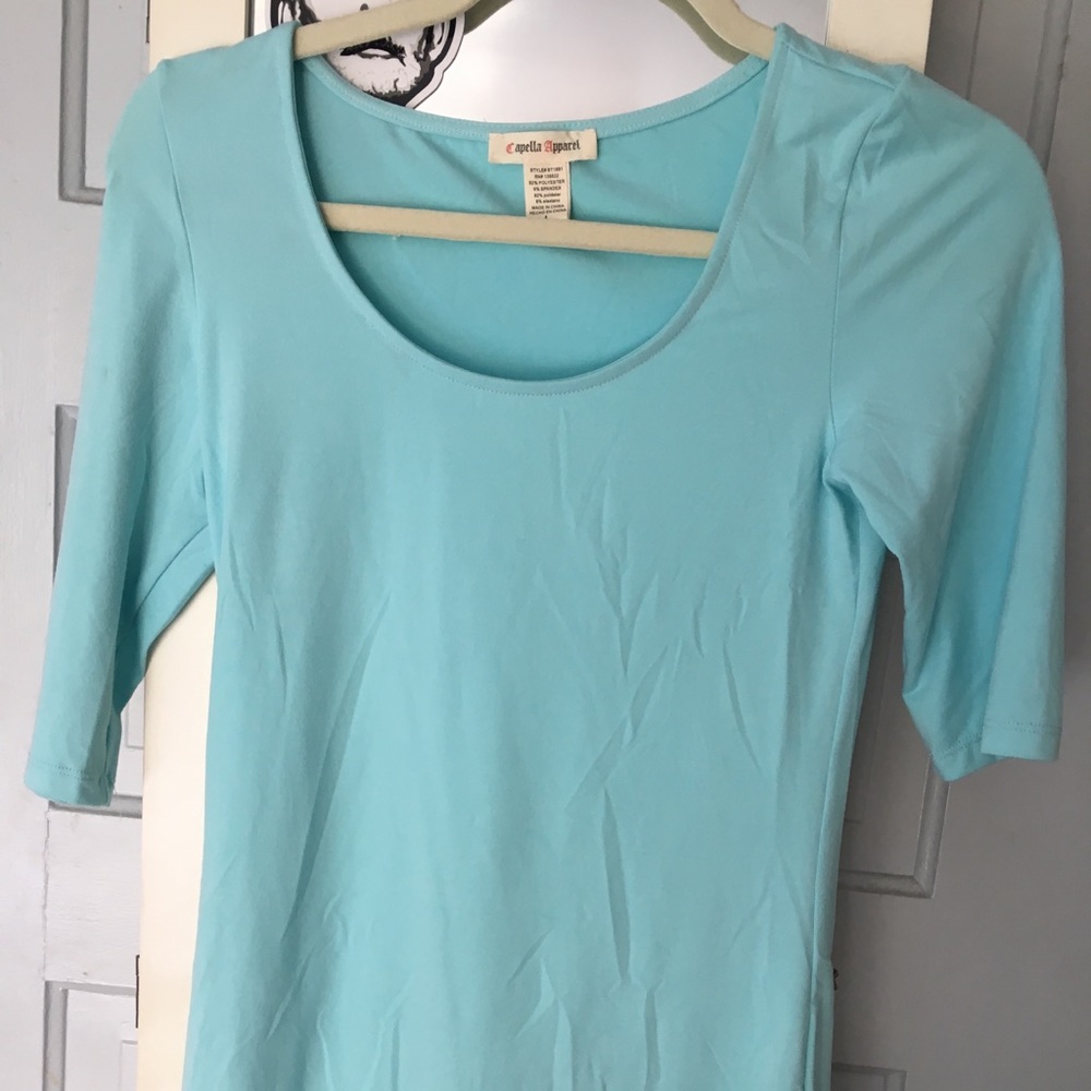 Lt turquoise scoop neck stretchy 3/4 sl. shirt.