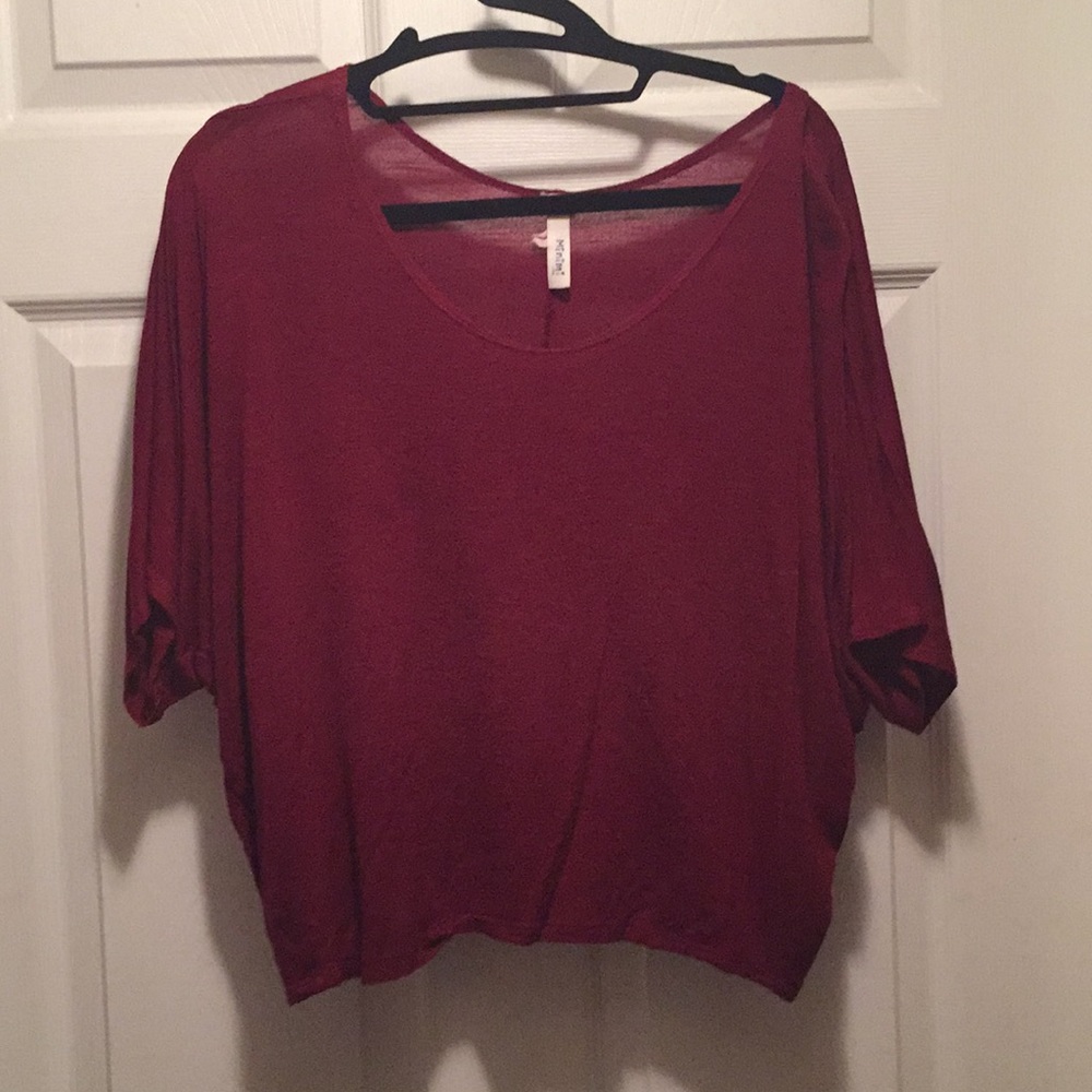 Red/ maroon shirt sleeve shirt.