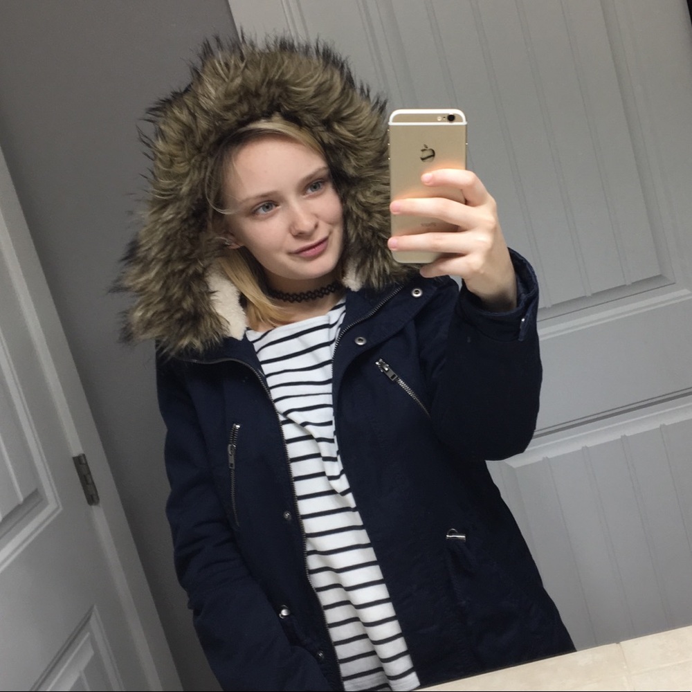 navy blue jacket with brown faux fur hood