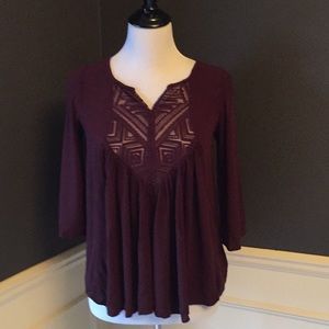 Burgundy embroidered swing top.