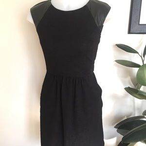 Black cocktail dress with faux leather shoulders