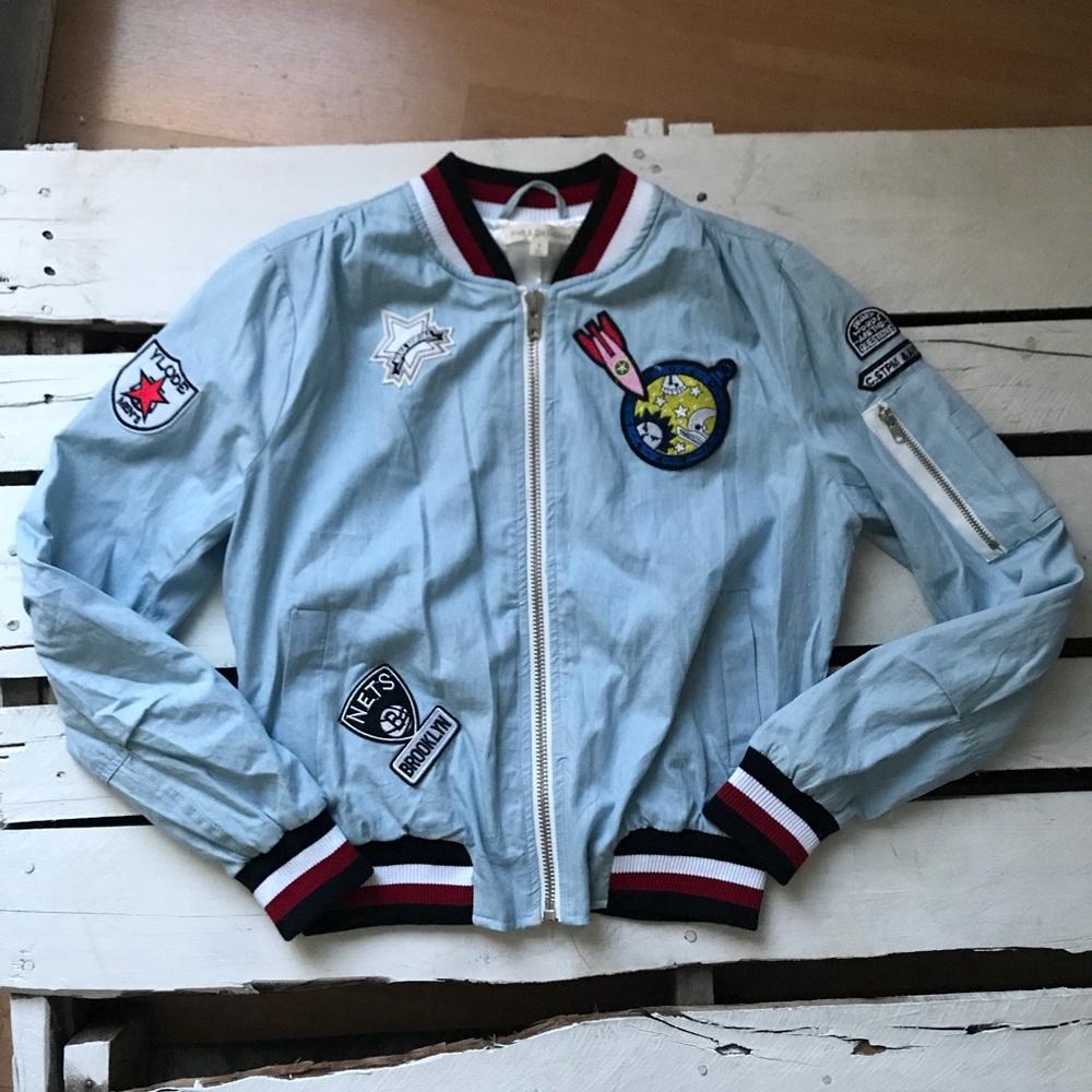 Light denim bomber jacket with patches