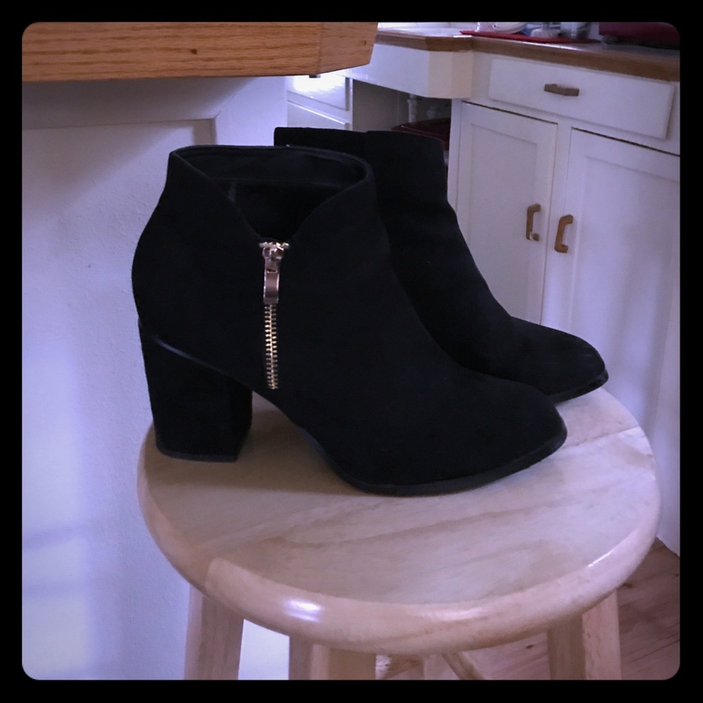 Black booties with gold zipper