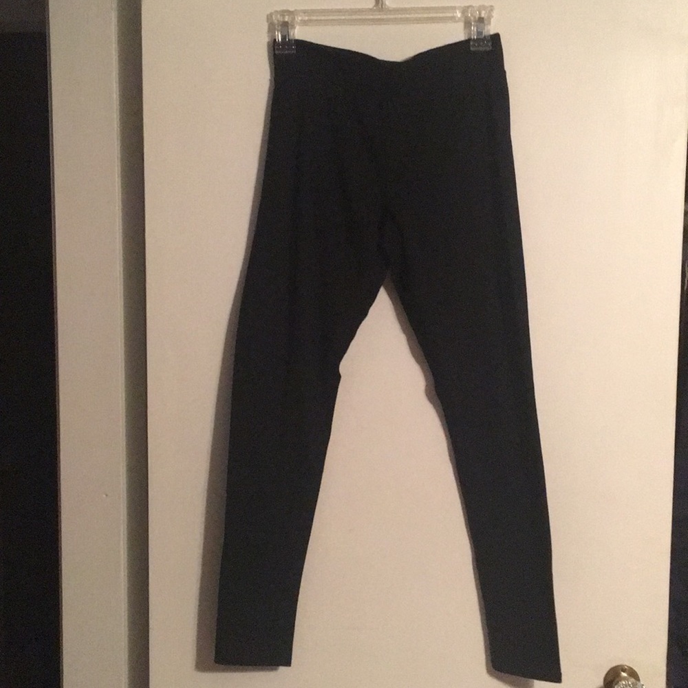 Women's wide waistband black leggings.