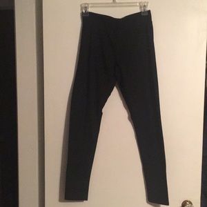 Women's wide waistband black leggings.