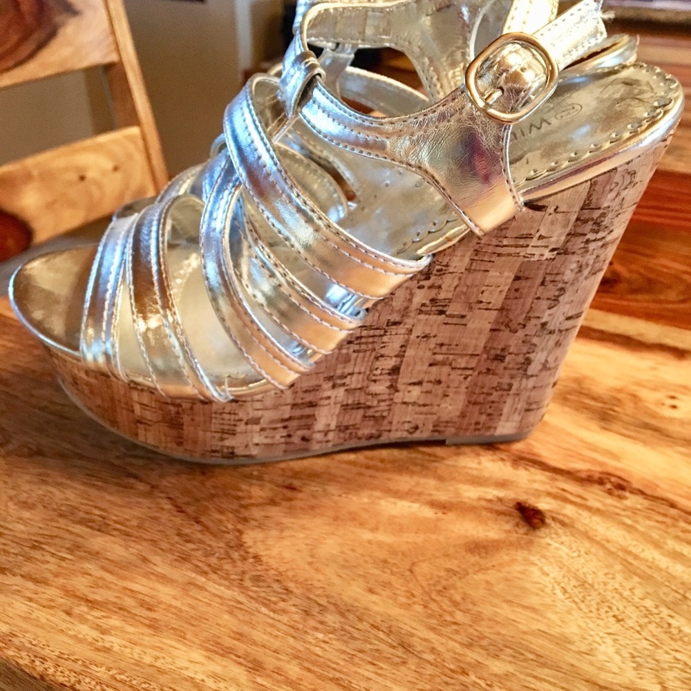 New!!! Never worn. Silver wedge sandals. 7.5