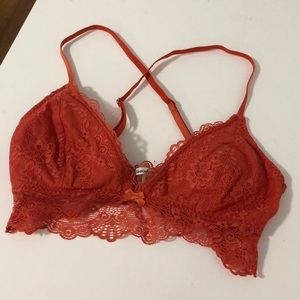 Orange lace bralette with removable padding.