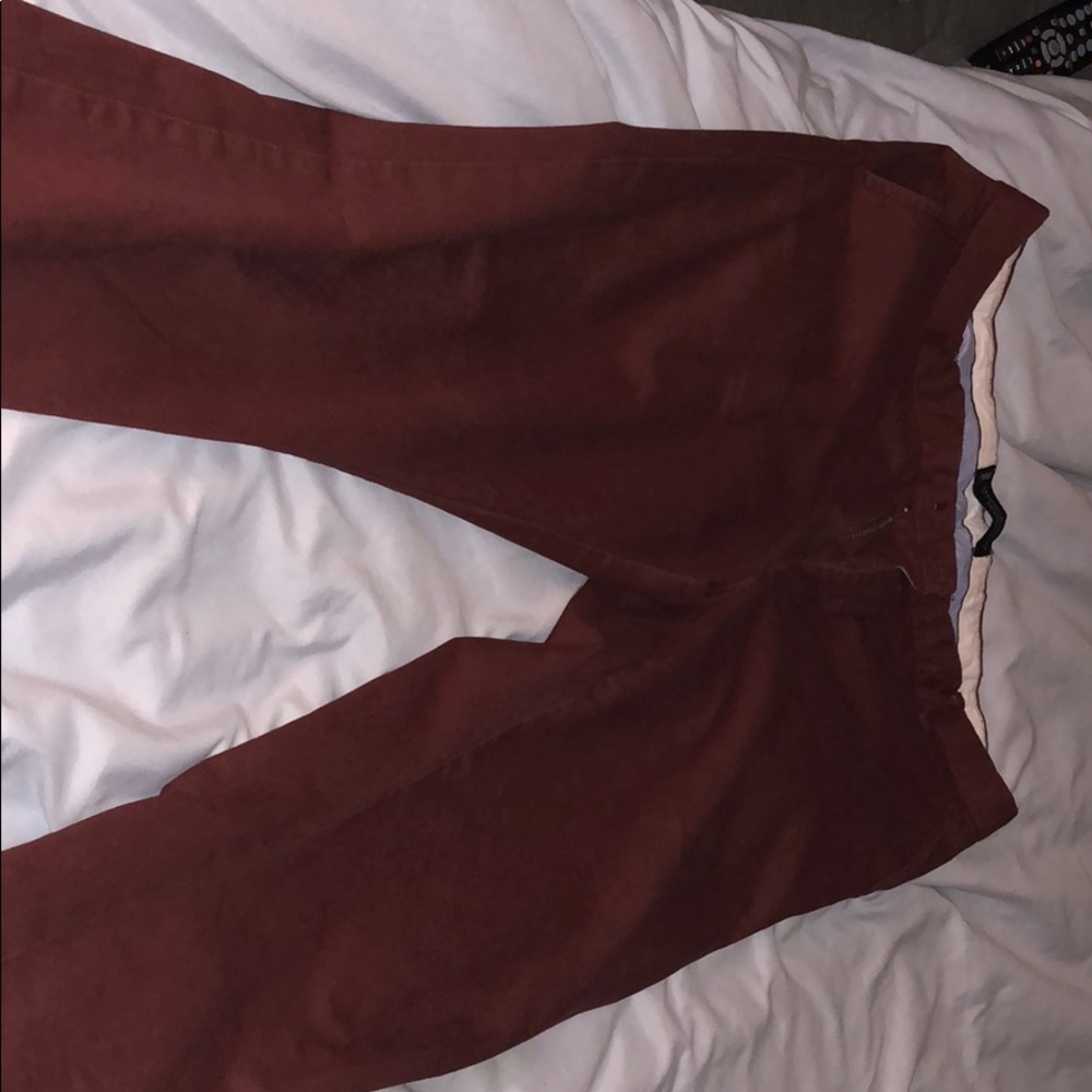 Men’s burgundy/red slim fit dress pants.