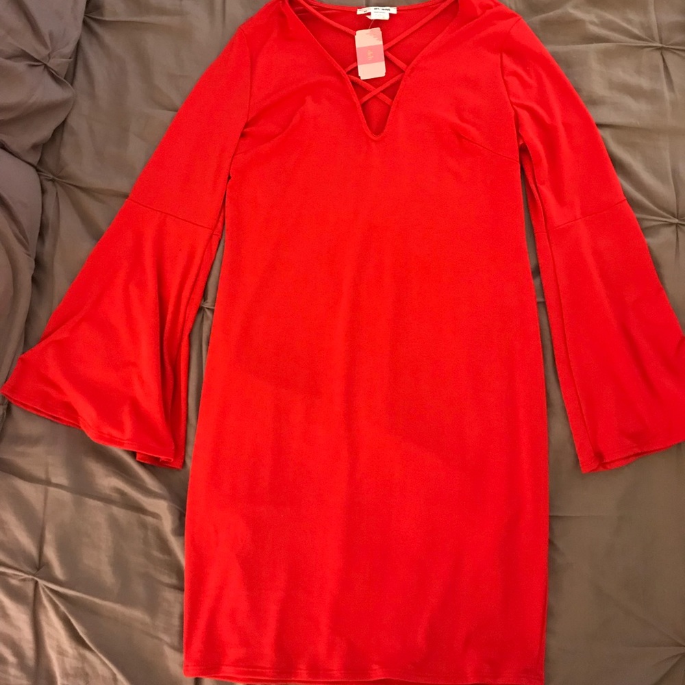 NEW!  Bodycon dress with bell sleeves.