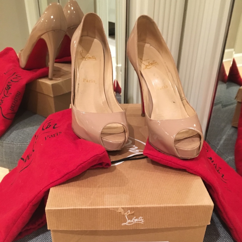 Christian Louboutin nude open toe pumps.