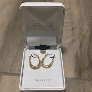 14K gold earrings.