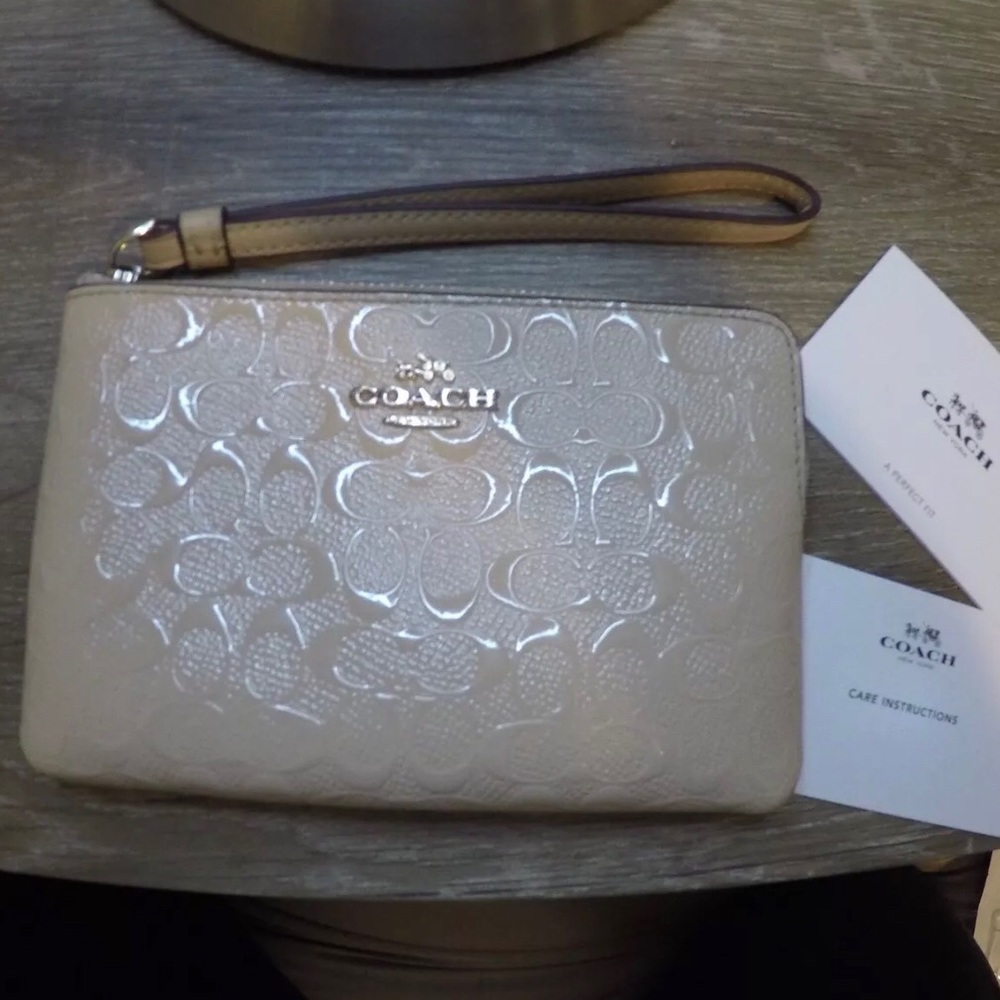 Slightly used authentic coach cream wristlet