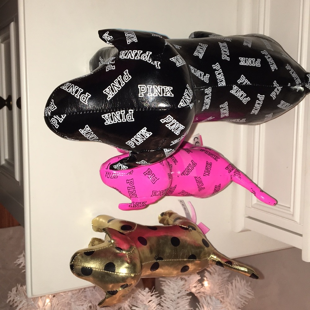 Lot of 3 pink dogs.