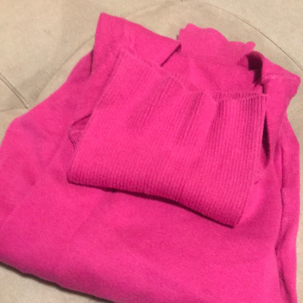Pink turtle neck.