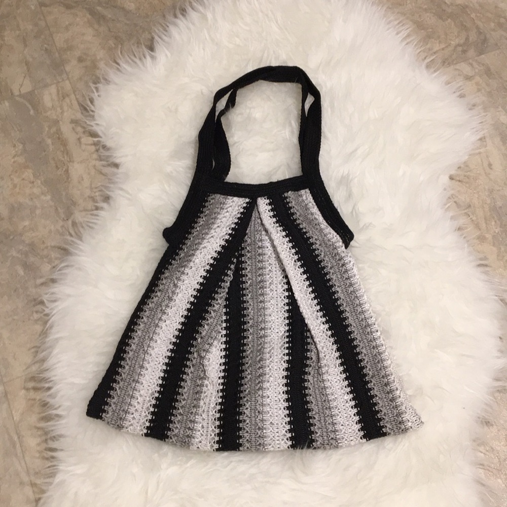 Triangular shaped black, white, gray purse
