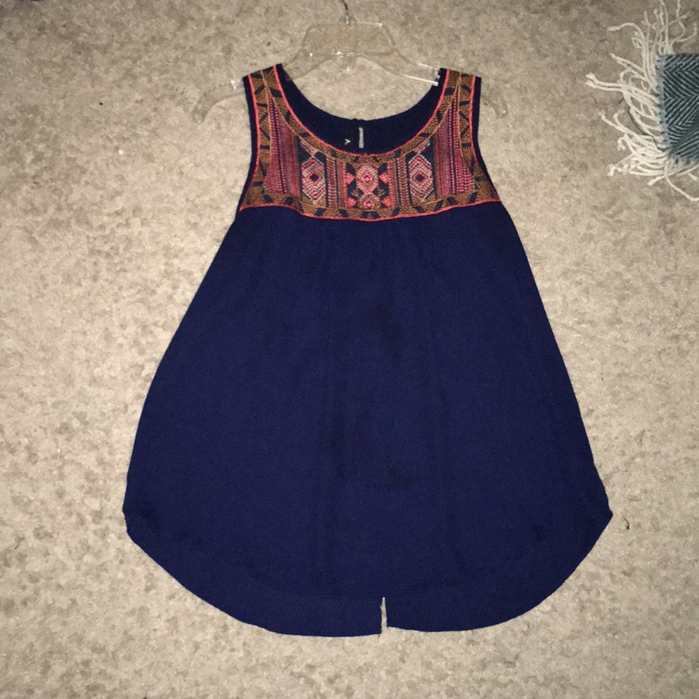 Navy blue sleeveless top with embroidery on top