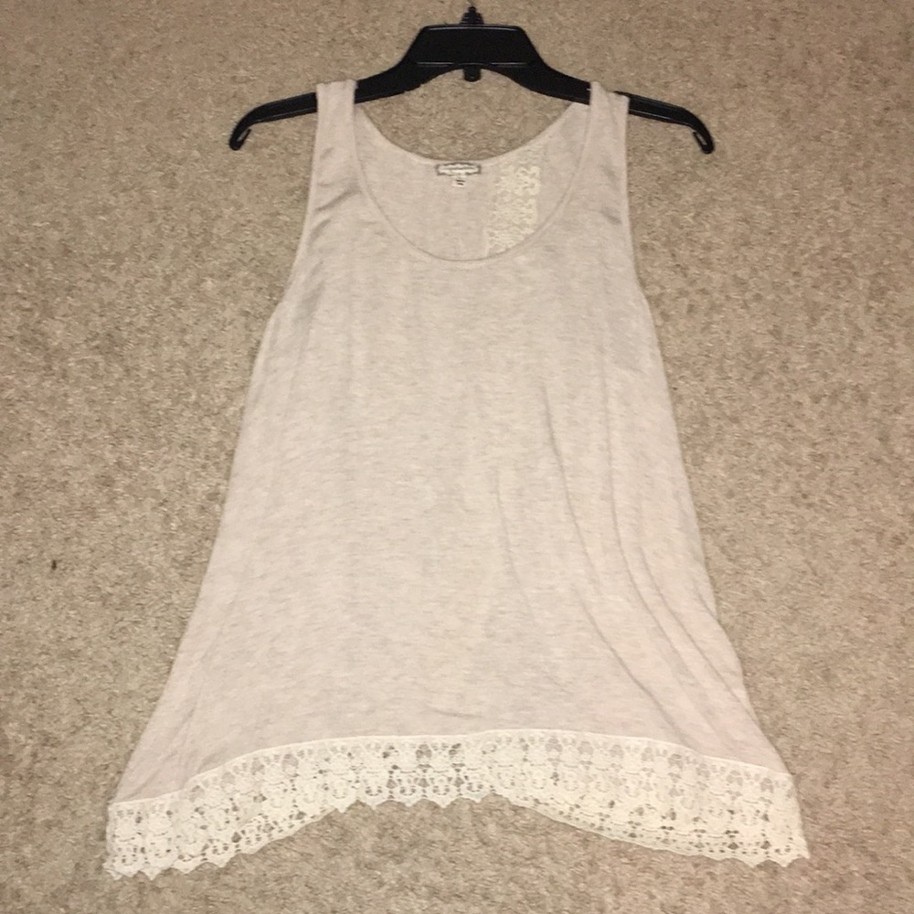 Beige sleeveless top with white lace and open back