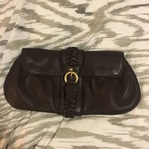 Brown leather clutch