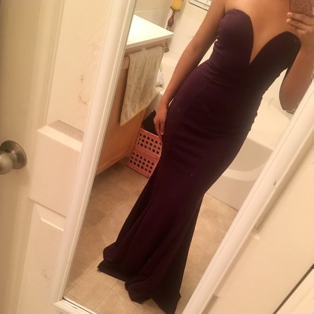 Long fitted purple gown w/ plunging neckline