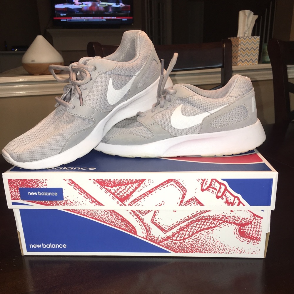 Gray Nike tennis shoes. Size 7.5