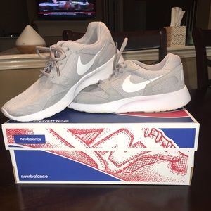 Gray Nike tennis shoes. Size 7.5