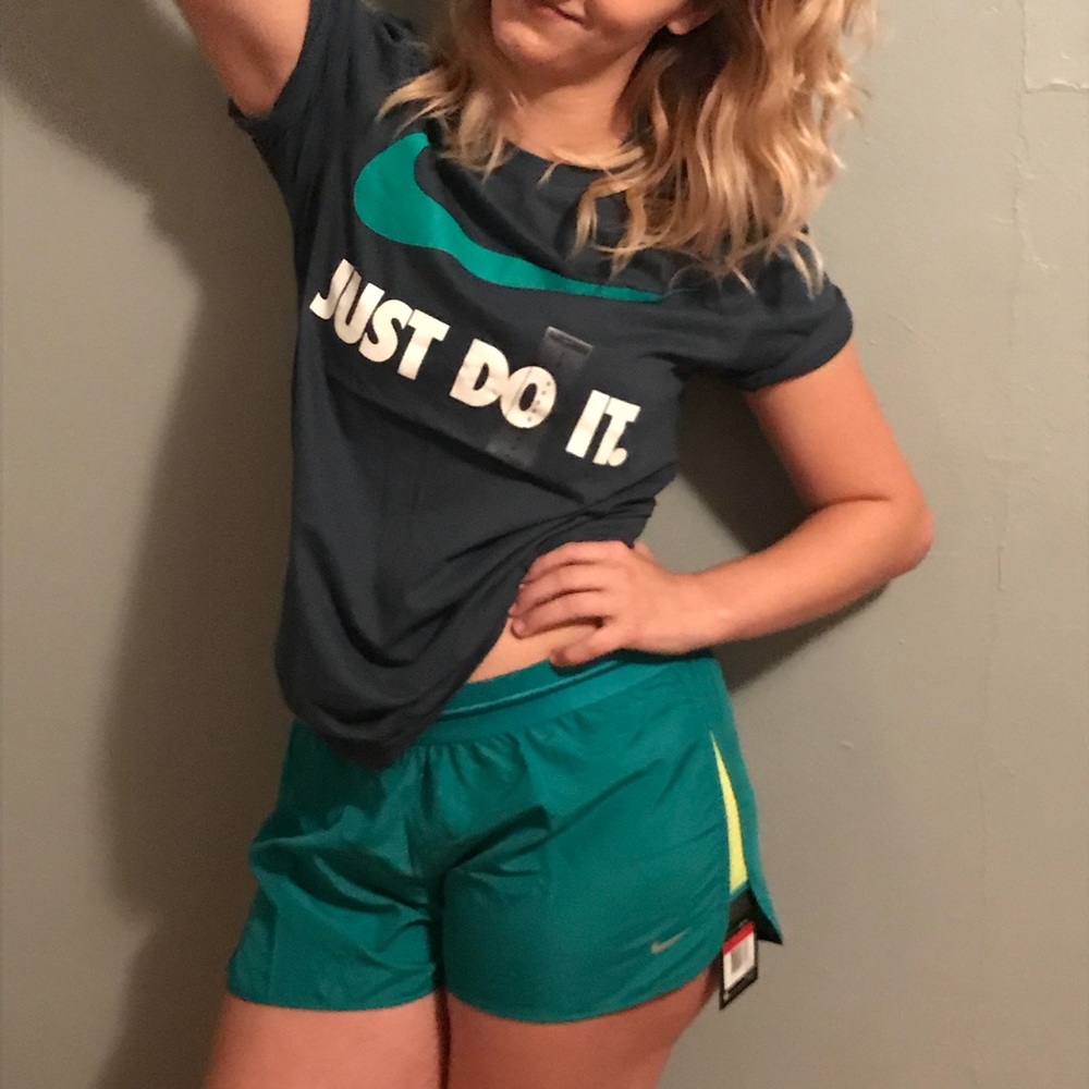 Teal green Nike running shorts