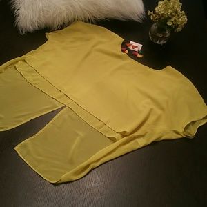 Yellow flowy hi-lo/split tail chiffon like Shirt.