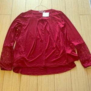 Dark red dress shirt.