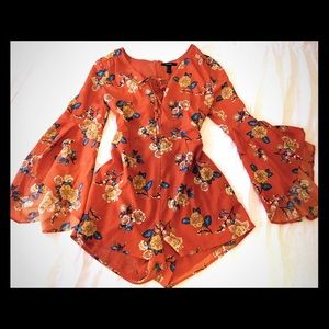 Floral print romper with long bell sleeves