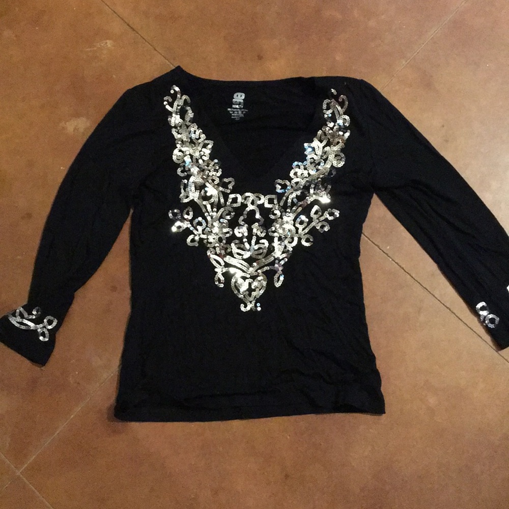 Black top with silver sequined detail. Never worn.