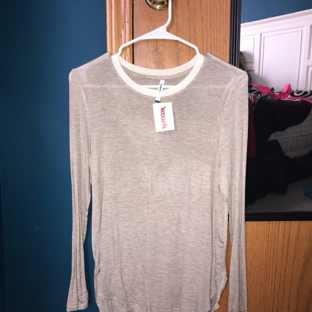 Sand/tan colored long sleeve tee.