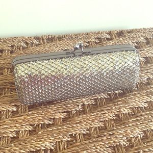 Super cute Gold/silver glitter clutch.