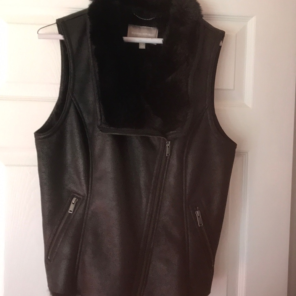 Faux leather vest with fur trim.