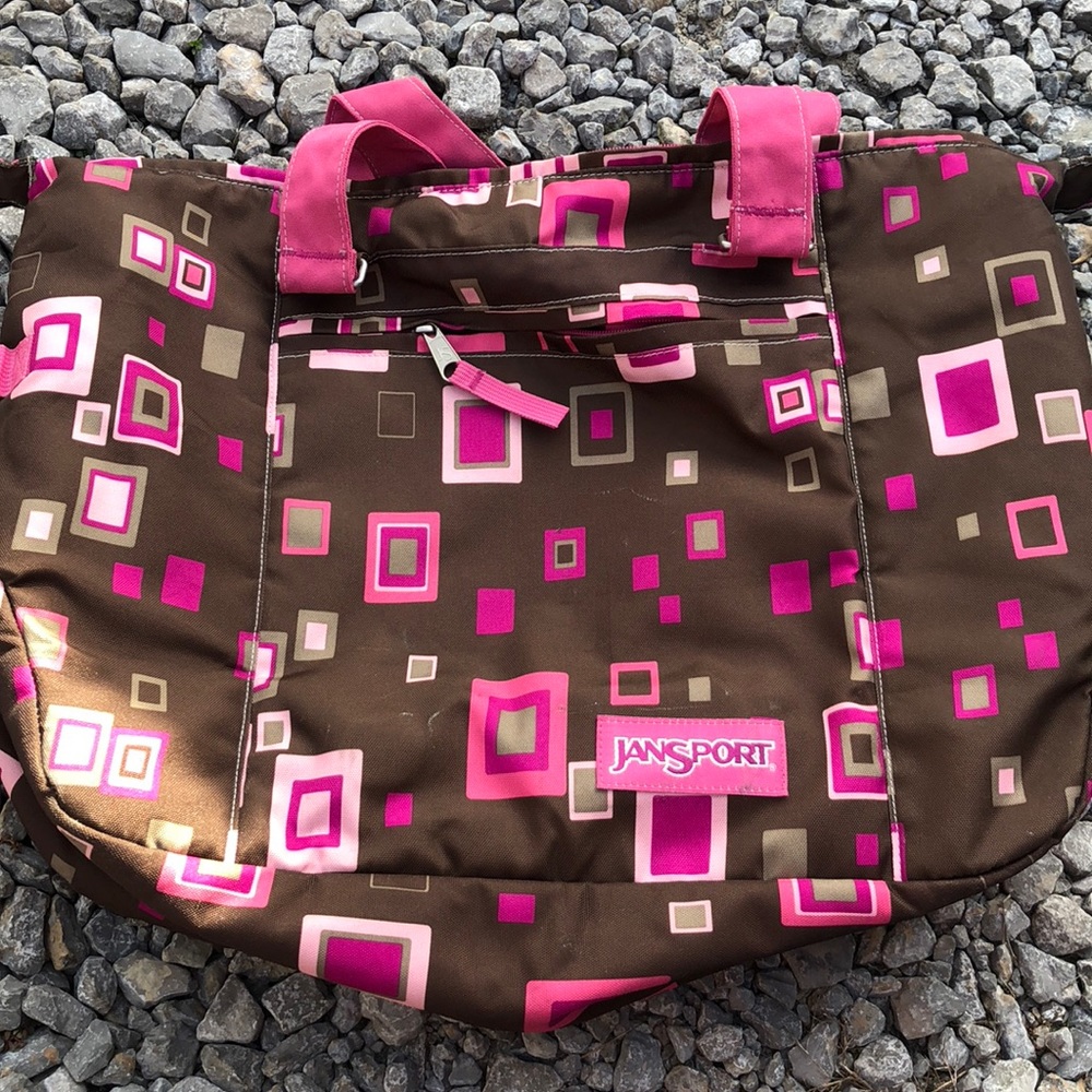Brown and pink jansport bag