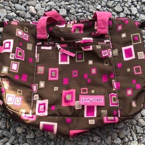 Brown and pink jansport bag