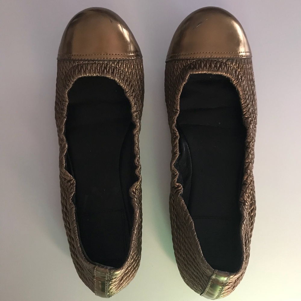 Tory Burch gold ballet flats.