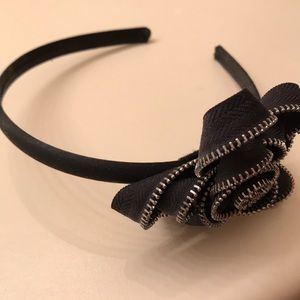 Headband with black and silver flower on the side