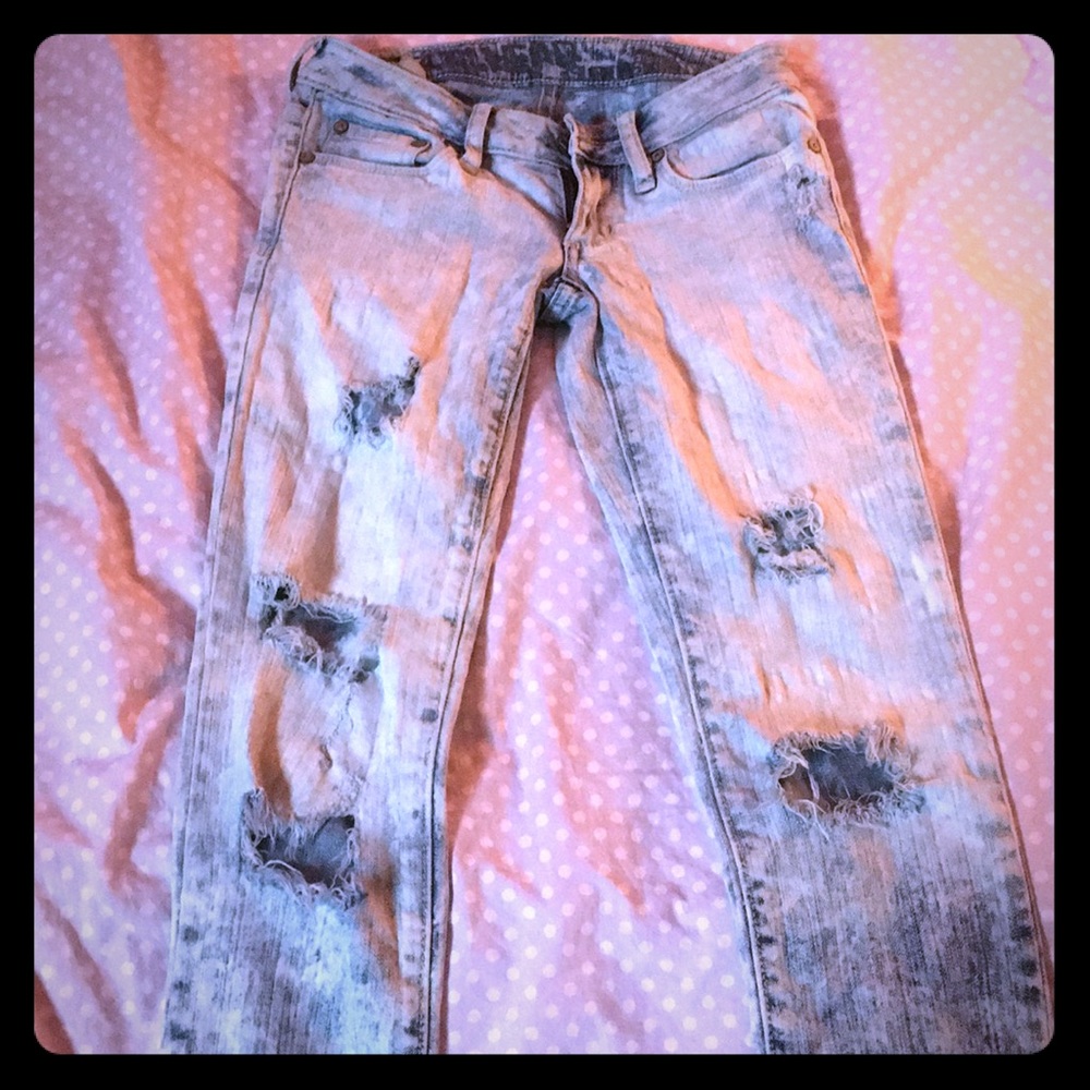 Acid washed ripped jeans