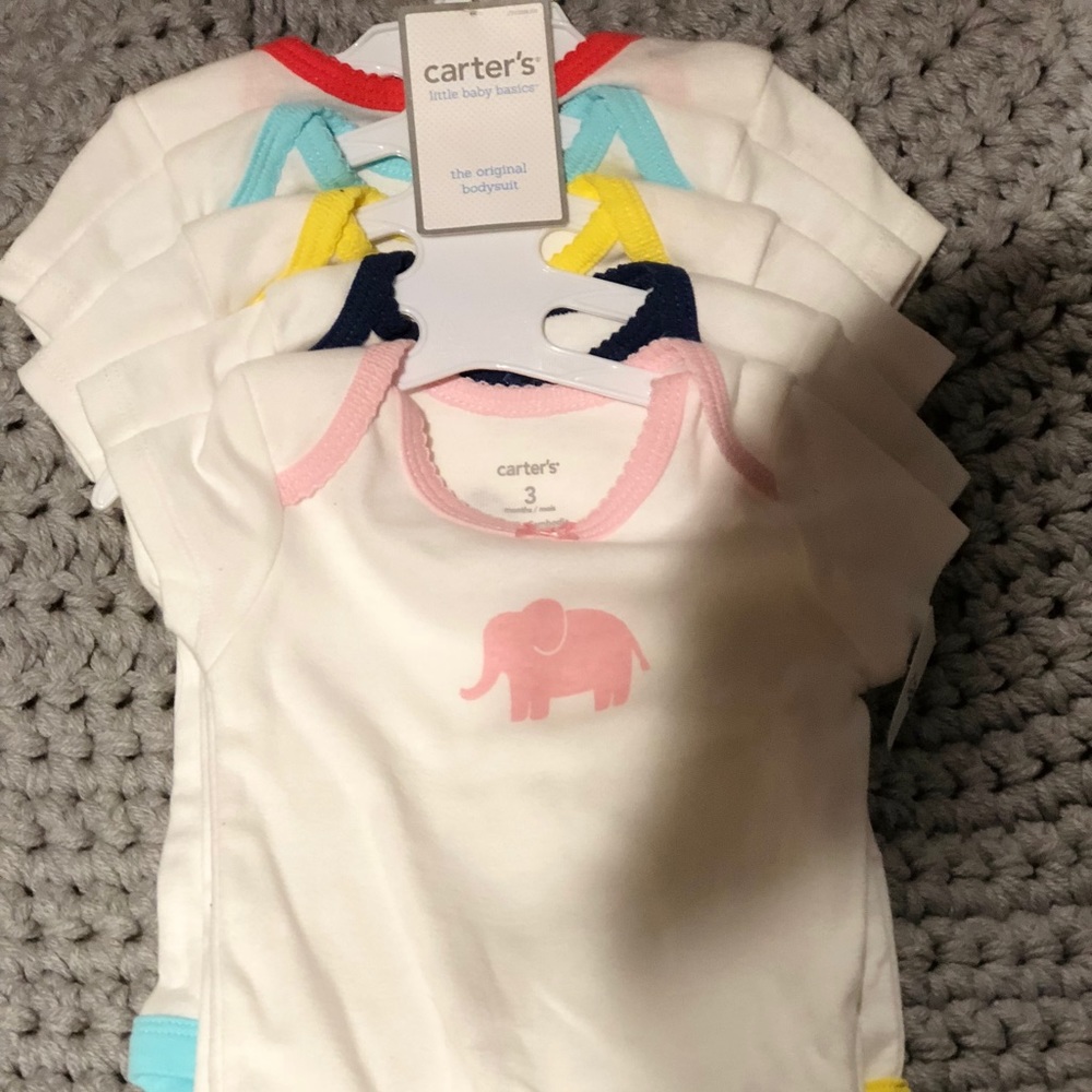NWT 5 pack of Carter’s baby girl onesies SO CUTE