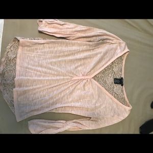 Cute pink half sleeve top with lace back.