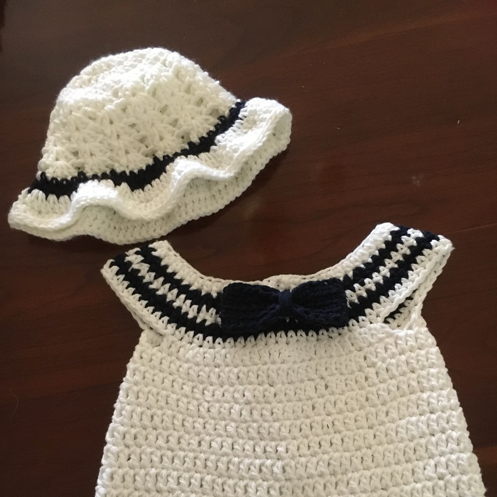 Hand crocheted cotton sundress and hat.