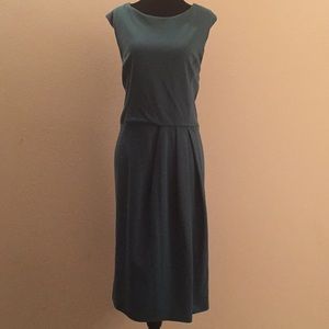 Teal dress with pleating to flatter the figure