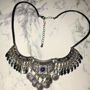 Bohemian like metal and leather statement necklace