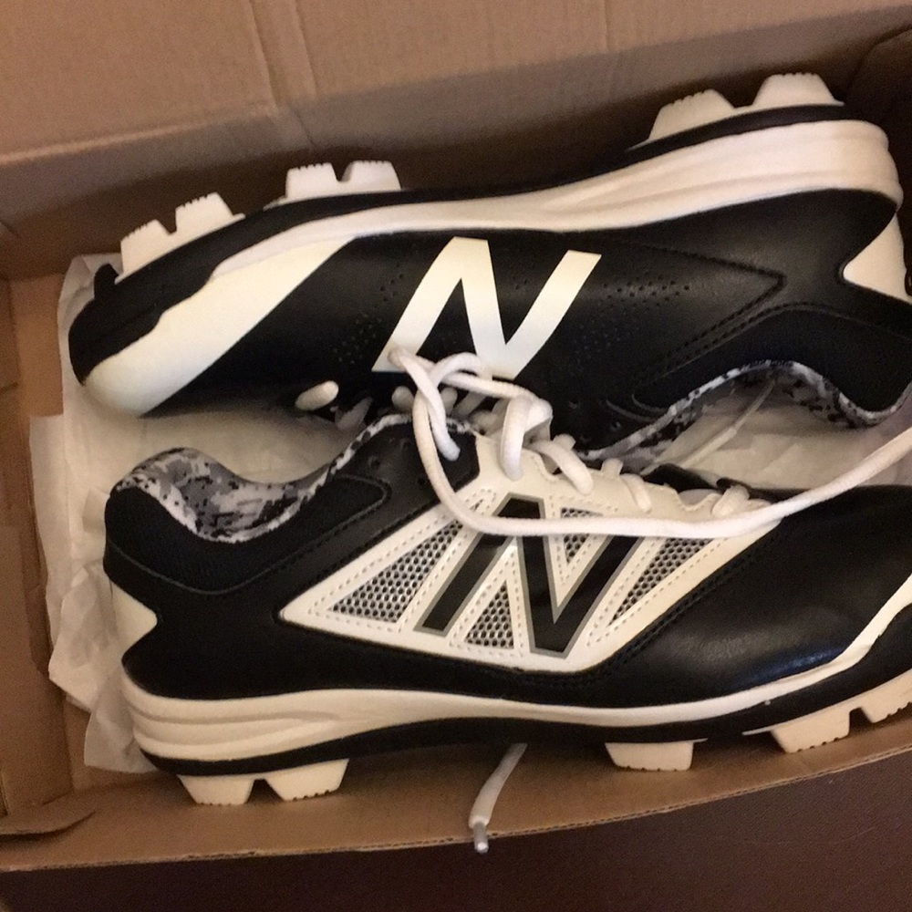 White and black baseball shoes