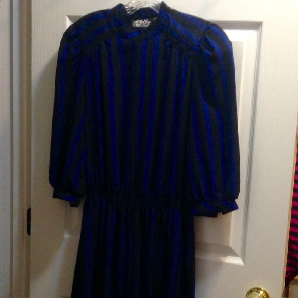 Vertical striped shirred waist dress is sassy.