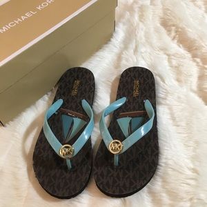 Michael Kors logo sail flip flops