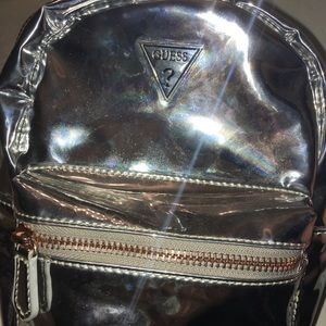 This is a guess mini book bag  light worn