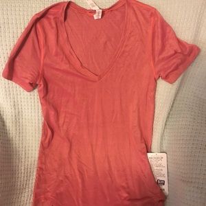 Size 4 pink LuLulemon shirt.